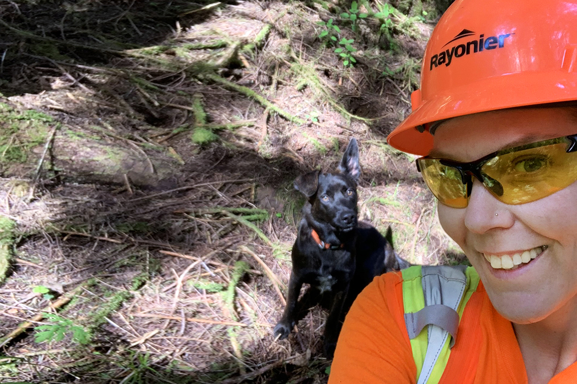 Woman in Forestry with working Dog